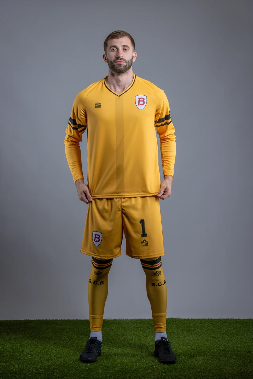 SC Brooklyn goalkeeper wearing the full gold Admiral goalkeeper kit